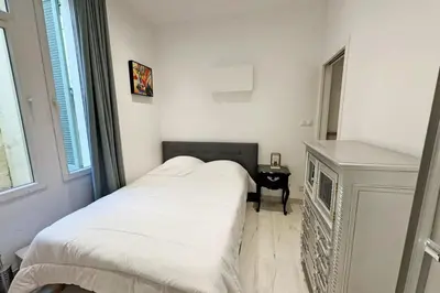 a small bedroom with a bed and a window at REF 1971- Apartment for rent basse Californie in Cannes