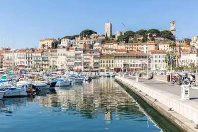 a group of boats docked in a harbor with buildings at REF 1971- Apartment for rent basse Californie in Cannes