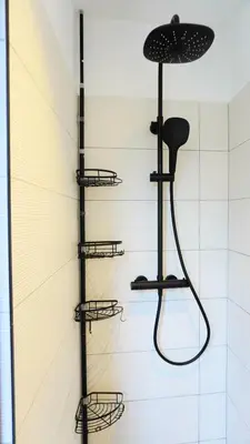 a shower in a bathroom with four shelves at Proche Croisette, Appartement 2 Chambres by Palmazur Vacances in Cannes