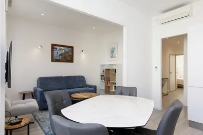 a living room with a white table and chairs at Modern Jaurès-Center-Clim-Wifi-Festival in Cannes