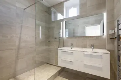 a bathroom with a sink and a glass shower at Modern Jaurès-Center-Clim-Wifi-Festival in Cannes