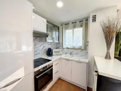 a white kitchen with a sink and a microwave at A 2 pas des plages et centre 324L TER in Cannes