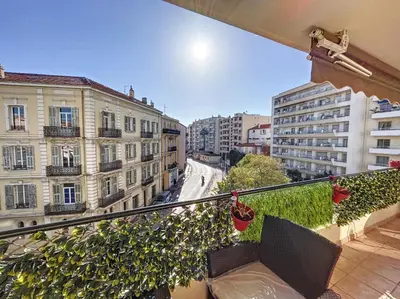 a balcony with a view of a street and buildings at A 2 pas des plages et centre 324L TER in Cannes