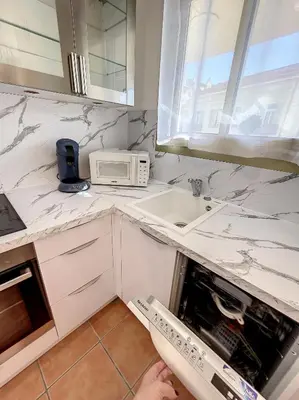 a kitchen with a sink and a microwave at A 2 pas des plages et centre 324L TER in Cannes