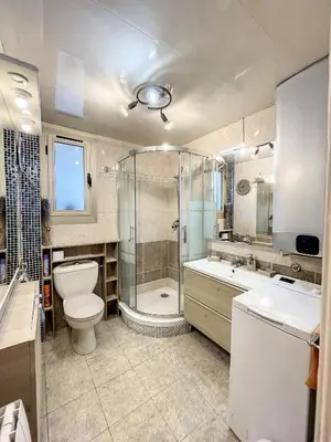 a bathroom with a toilet and a shower and a sink at A 2 pas des plages et centre 324L TER in Cannes