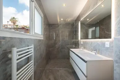 a bathroom with a sink and a window at 3 bedrooms 2 terraces in Cannes in Cannes