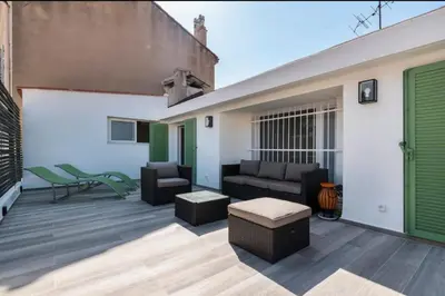 a patio with a couch and a table at 3 bedrooms 2 terraces in Cannes in Cannes
