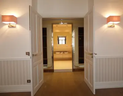 a bathroom with two lights on the wall at Arthur Properties Croisette in Cannes