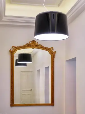 a mirror with a light and a black ceiling at Arthur Properties Croisette in Cannes
