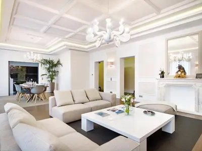 a living room with a couch and a table at Arthur Properties Croisette in Cannes