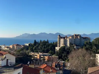 a view of a city with the ocean in the background at C010 - Magnifique Appartement Toit Terrasse in Cannes