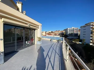 a shadow of a person on the balcony of a house at C010 - Magnifique Appartement Toit Terrasse in Cannes