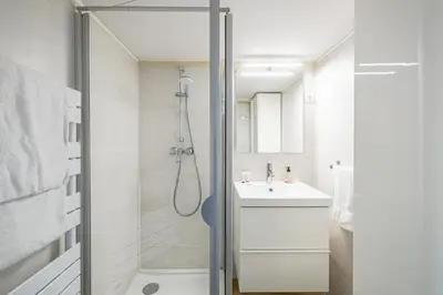 a bathroom with a shower and a sink at L'HONORAT vue mer et port, à côté des plages du Midi et proche du Palais in Cannes