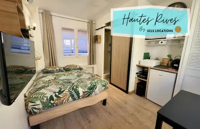 a small bedroom with a bed and a sign that reads truckers busesay association at Haute-Rive By SCLS Locations in Cannes