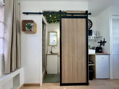 a door leading into a kitchen with a sink at Haute-Rive By SCLS Locations in Cannes