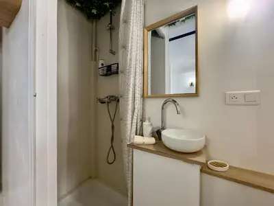 a bathroom with a sink and a mirror at Haute-Rive By SCLS Locations in Cannes