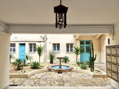 a courtyard with a fountain in front of a building at Haute-Rive By SCLS Locations in Cannes