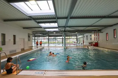 a group of people in a swimming pool at Superbe studio pour congrés au coeur de Cannes in Cannes