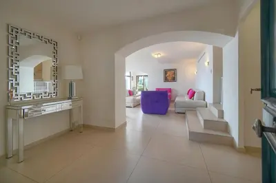 a living room with a couch and a mirror at IMMOGROOM - Exceptional Villa - Sea View - Pool in Vallauris