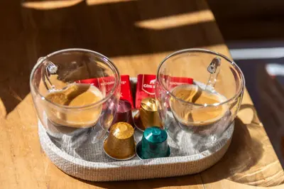 a tray with two wine glasses on a table at La Suite Tentation in Cannes