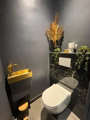a bathroom with a white toilet and a sink at La Suite Tentation in Cannes