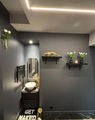 a bathroom with a sink and a mirror on the wall at La Suite Tentation in Cannes