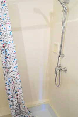 a shower curtain in a bathroom with a tub at Sunny 1 Bedroom Rue Commandant André in Cannes