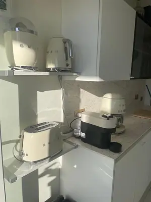 a kitchen with two toasters and a toaster on a counter at appartement centre ville cannes vue mer in Cannes