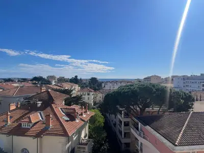 a view of a city with roofs and buildings at appartement centre ville cannes vue mer in Cannes