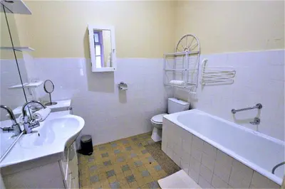 a bathroom with a tub and a toilet and a sink at Sea View Apartment in Cannes
