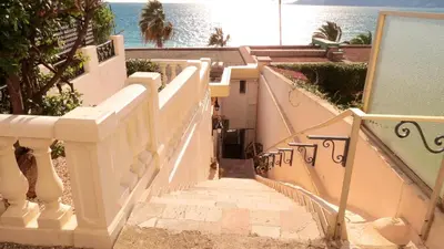 a set of stairs leading down to the beach at Sea View Apartment in Cannes