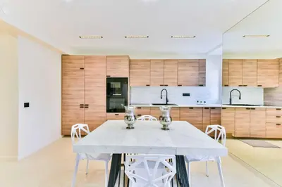 a kitchen with a white table and chairs at Cosy apartment with parking - Cannes - Mobility Lease in Cannes