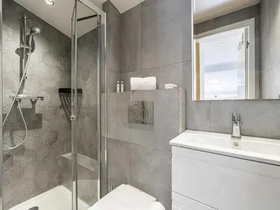 a bathroom with a shower and a toilet and a sink at Bright duplex-Cannes Centre -Mobility lease in Cannes