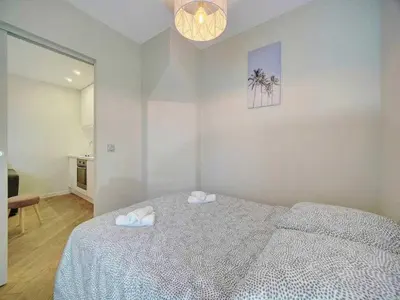 a bedroom with a bed with two towels on it at Cosy flat in Cannes - Mobility lease in Cannes
