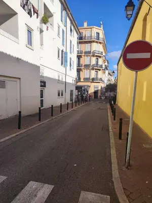 an empty street with a do not enter sign on the road at Studio - Suquet Forville in Cannes