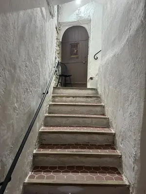 a set of stairs leading to a door in a building at Studio - Suquet Forville in Cannes