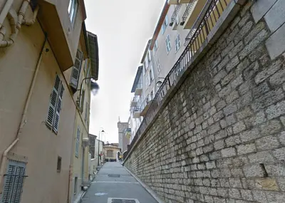 an empty alley between two buildings and a brick wall at Bela Vista By SCLS Locations in Cannes