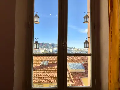 a window with a view of a roof at Bela Vista By SCLS Locations in Cannes