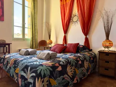 a bedroom with a bed with two pillows on it at Bela Vista By SCLS Locations in Cannes