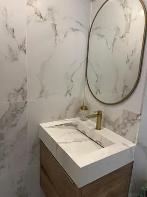 a bathroom with a sink and a mirror at Suite le Venitia - Appartement standing in Cannes