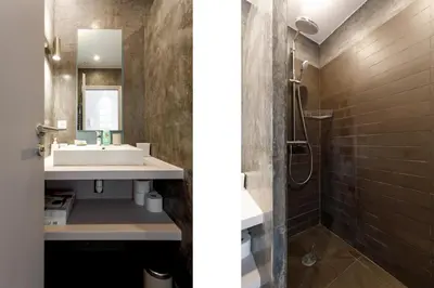 a bathroom with a sink and a shower at Le Napoléon, 1min Palais des Festivals in Cannes