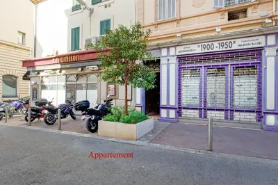 a group of motorcycles parked in front of a building at Le Napoléon, 1min Palais des Festivals in Cannes