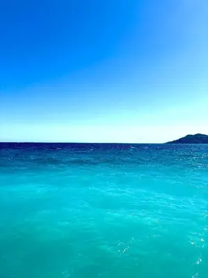 a large body of water with a blue ocean at Superbe appartement in Cannes