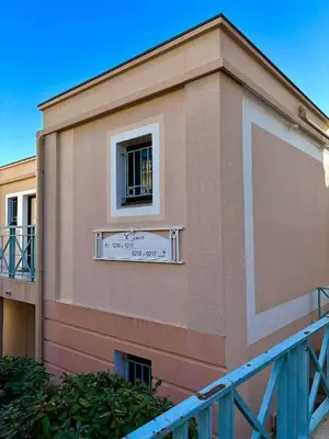 a building with a window with a sign on it at Superbe appartement in Cannes