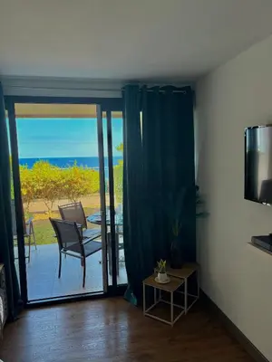 a living room with a view of the ocean at Superbe appartement in Cannes