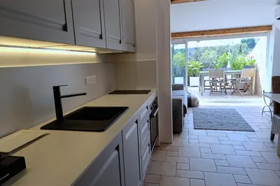 a kitchen with a sink and a counter top at Charming apartment in Cannes in Cannes