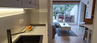 a kitchen with a counter with fruit on it at Charming apartment in Cannes in Cannes