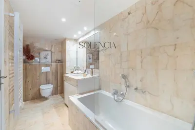 a bathroom with a tub and a sink and a toilet at 2 pièces rue d'Antibes - Climatisation in Cannes