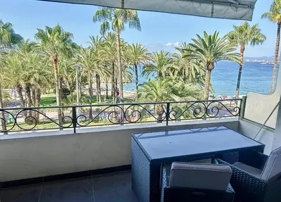 a balcony with a table and a view of the ocean at One bedroom apartment on La Croisette - Sea view in Cannes