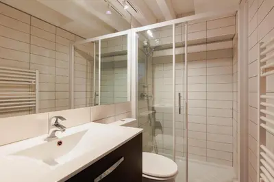 a bathroom with a sink and a toilet and a shower at Residence Aout 41 in Cannes